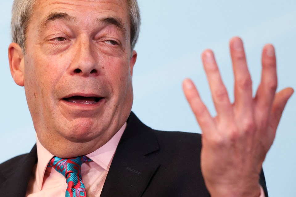 Britain’s Reform UK party leader Nigel Farage reacts as he speaks to the media, in London