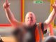 Brilliant moment steward who's the spitting image of darts legend is serenaded by football fans