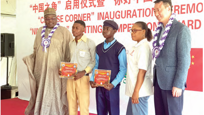 Chinese Ambassador to Nigeria, Yu Dunhai(Fifth from Right) with award winning students and officials of the FCT  Secondary Education Board