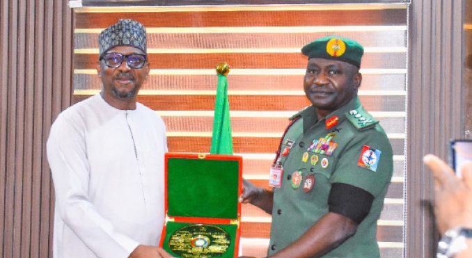 R-L: Chief of Defence Staff, General Christopher Musa, presenting gift to chairman, National Sports Commission, Shehu Dikko during a visit to the Defence Headquarters in Abuja, yesterday.