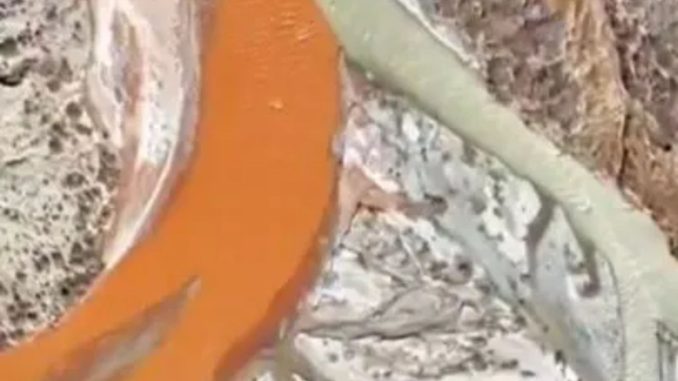 Incredible video shows China’s bizarre ‘half and half’ river where red and green waters flow but then don’t mix