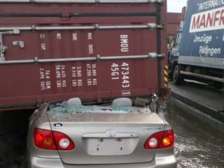 Man rescued unscathed as 40ft container crushes car in Lagos