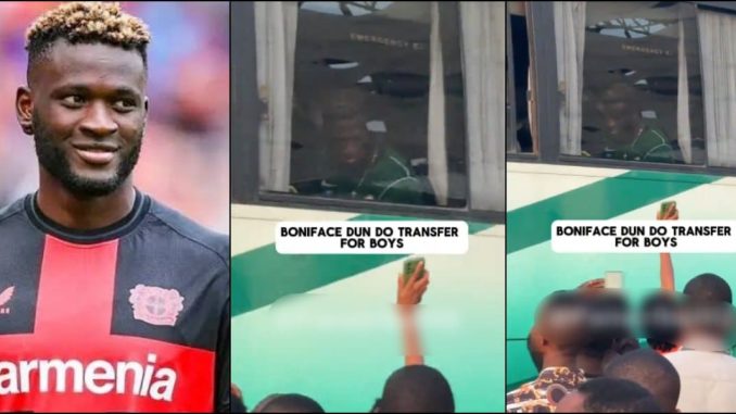 Moment Boniface transfers cash to fan while on team bus