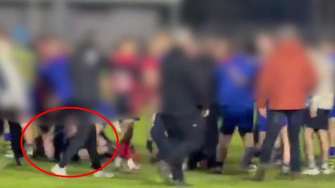 Shocking moment kids' rugby game explodes into violence as youngsters 'stamp and kick man on the ground'