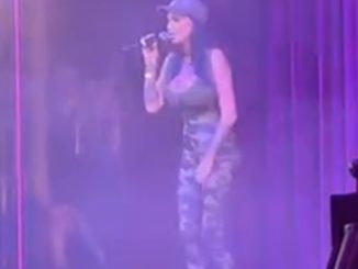 Watch as Katie Price hijacks the stage at drag contest to belt out hit single