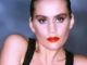 Wife of one of UK's most popular TV presenters looks incredible in classic pop music video - but can you tell who it is?