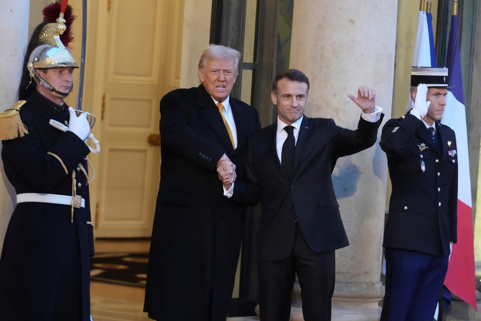 French President Emmanuel Macron and Donald Trump shake hands as they meet in Paris today