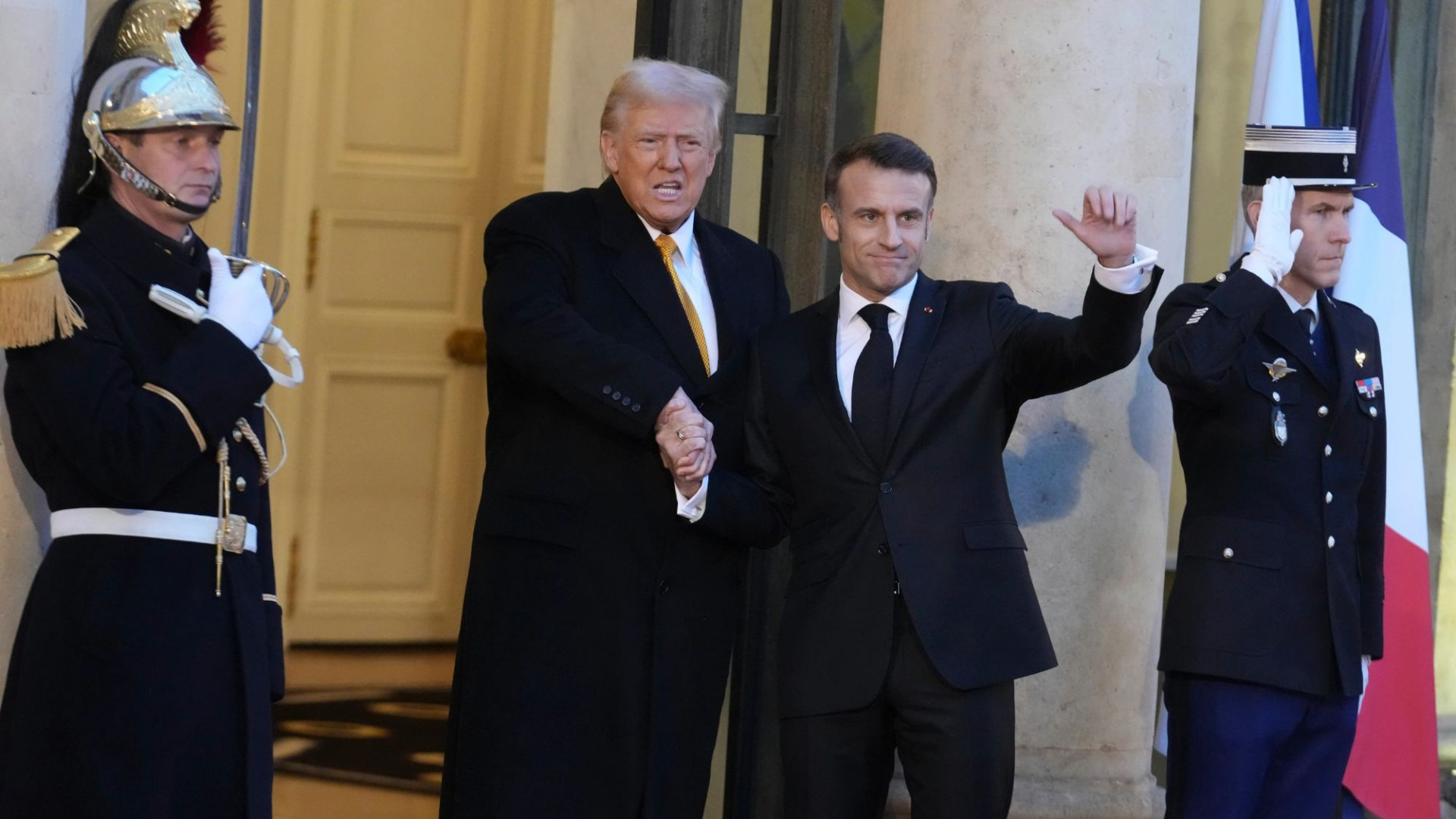 Donald Trump & Emmanuel Macron greet each other in Paris with bizarre power handshake ahead of Notre Dame reopening – The Scottish Sun