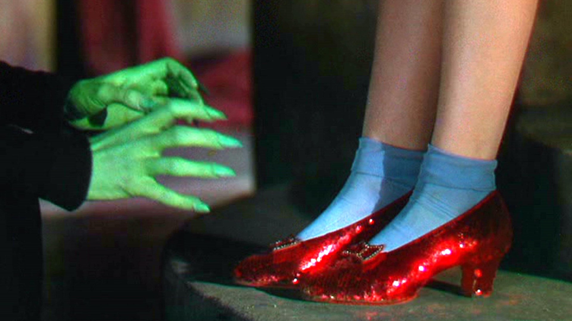 Judy Garland's iconic red slippers from The Wizard of Oz sell for eye-watering sum years after being STOLEN