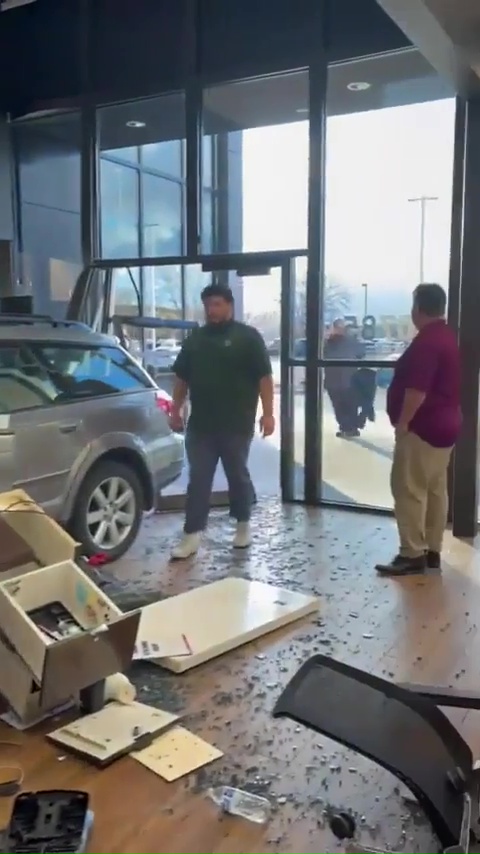 Shoppers went on to walk towards the Subaru Outback to check the damage done