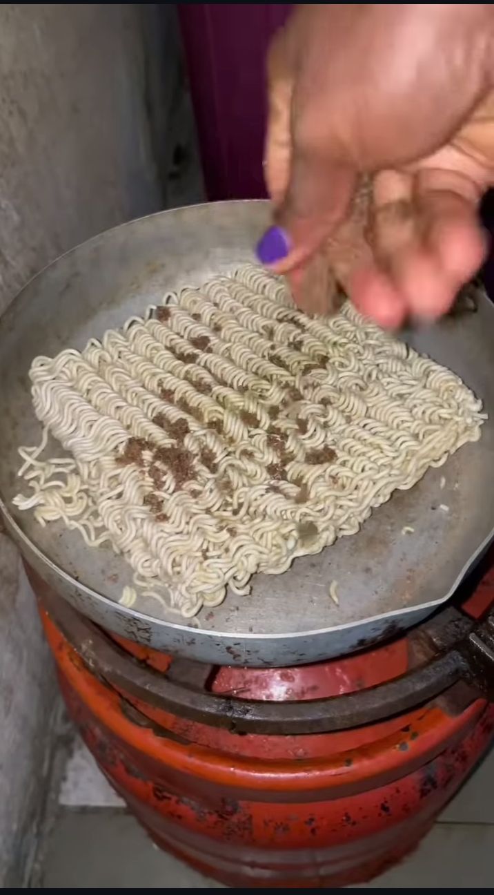 Nigerian lady indomie preparation 