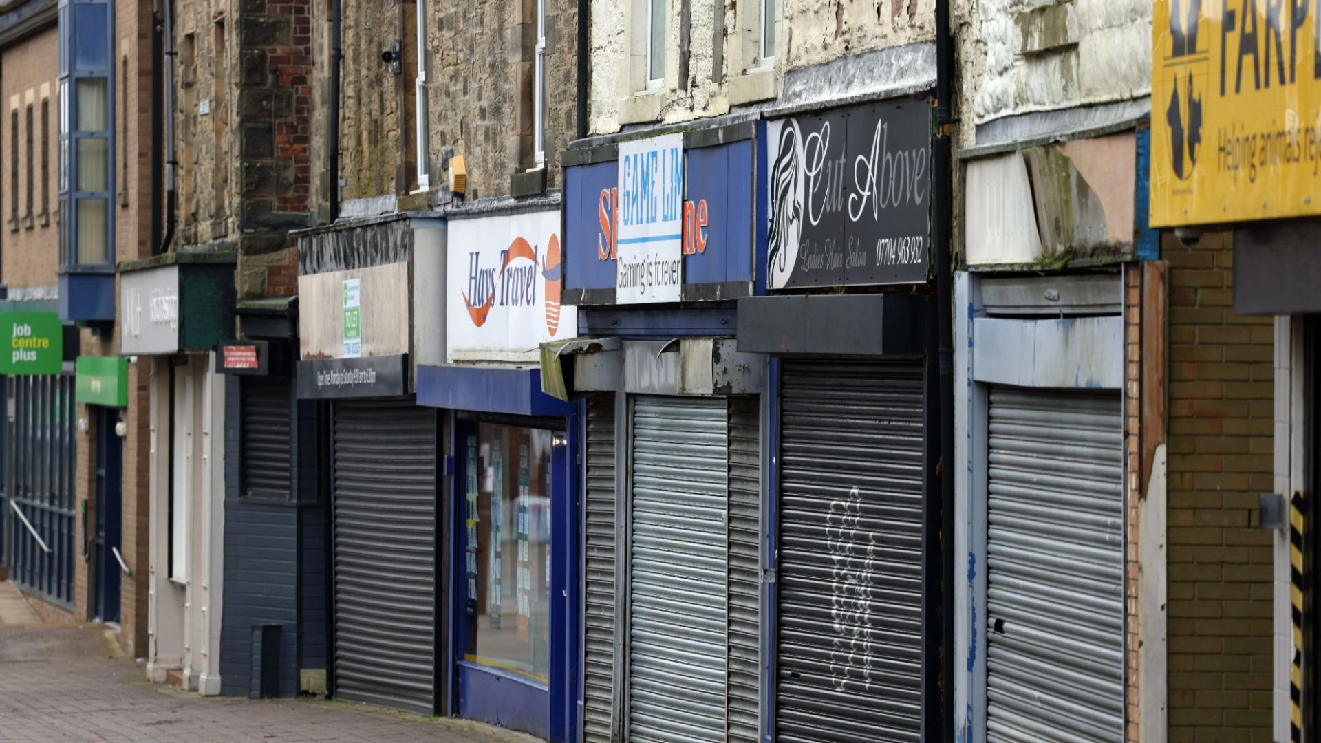 We live in one of Britain's UGLIEST towns with boarded up shops and derelict buildings - but the critics are all wrong