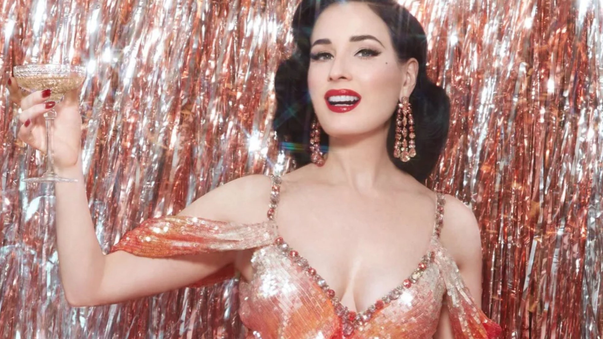 Dita Von Teese, 52, shows off her curves in sequin gown as she raises a glass to promote Las Vegas residency