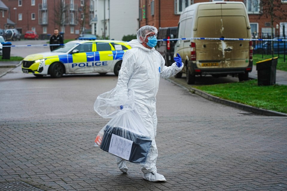 A forensics officer inside a police cordon on Friday