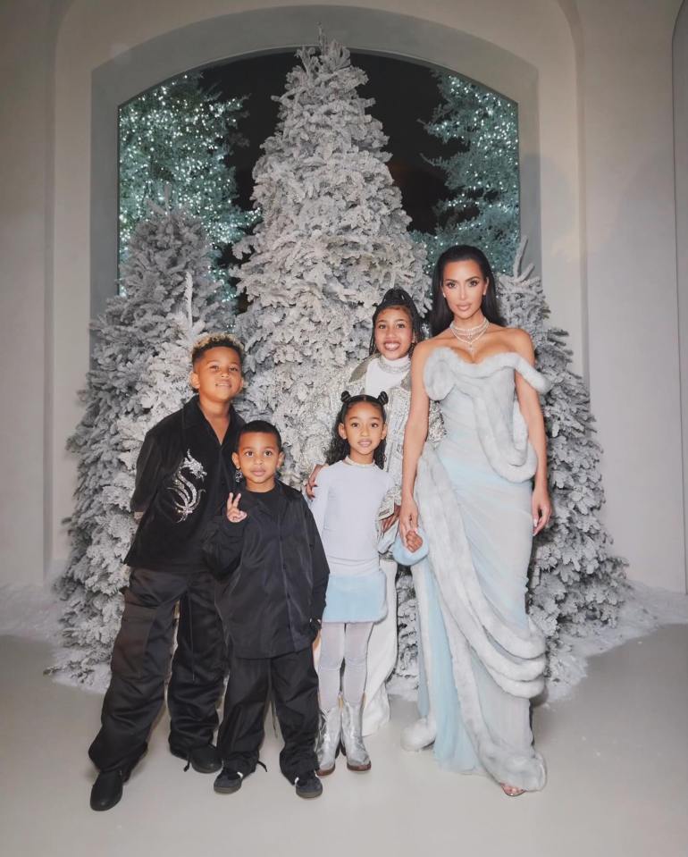 Kim has made the family Christmas snap a tradition - seen here at her Christmas Eve party