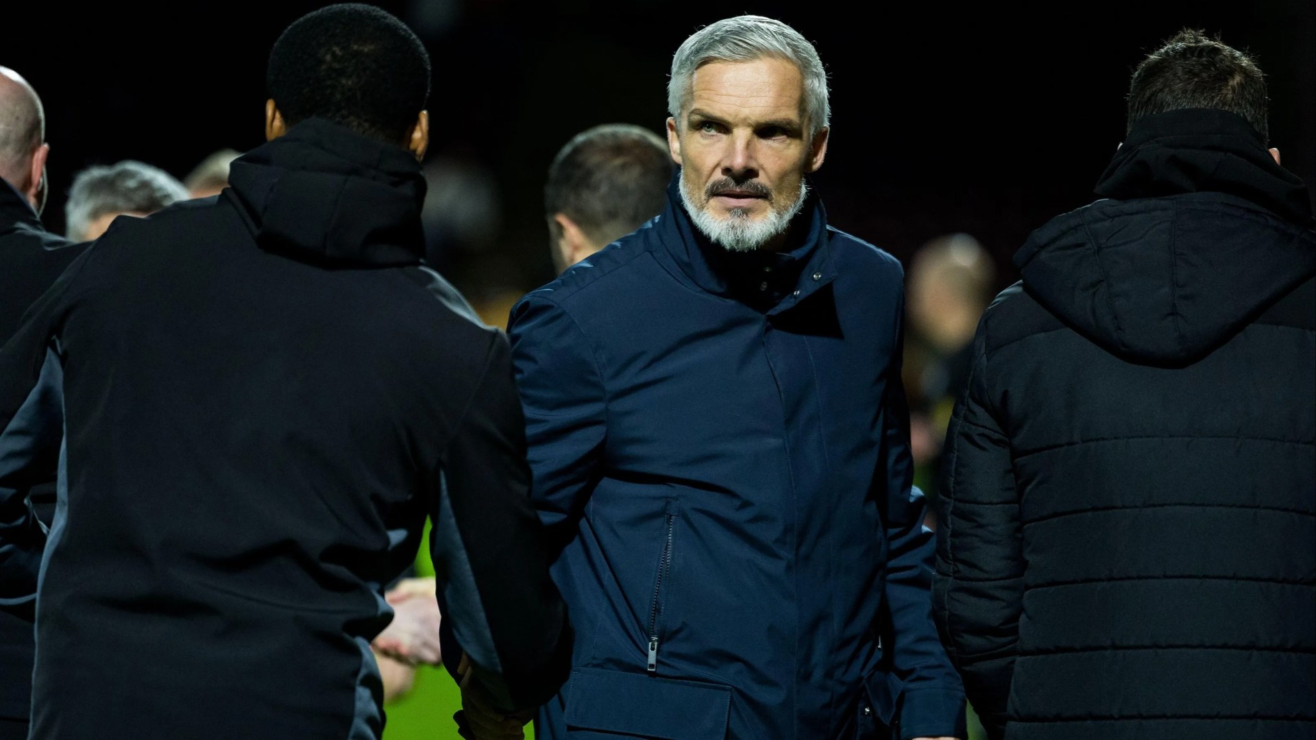 Cops launch probe after Jim Goodwin has vodka bottle, coins and flares lobbed at him by Aberdeen fans