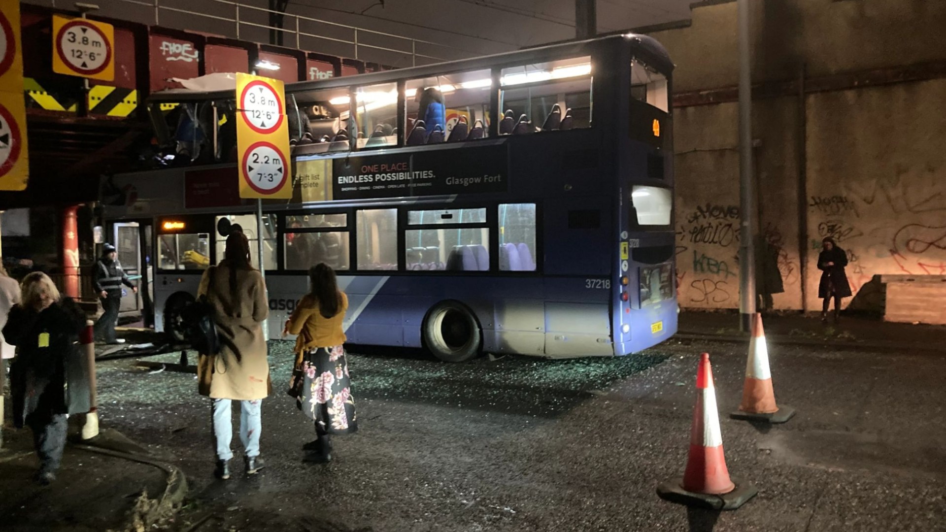 Double-decker bus crashes into bridge in Glasgow as pics show passengers 'trapped' on board