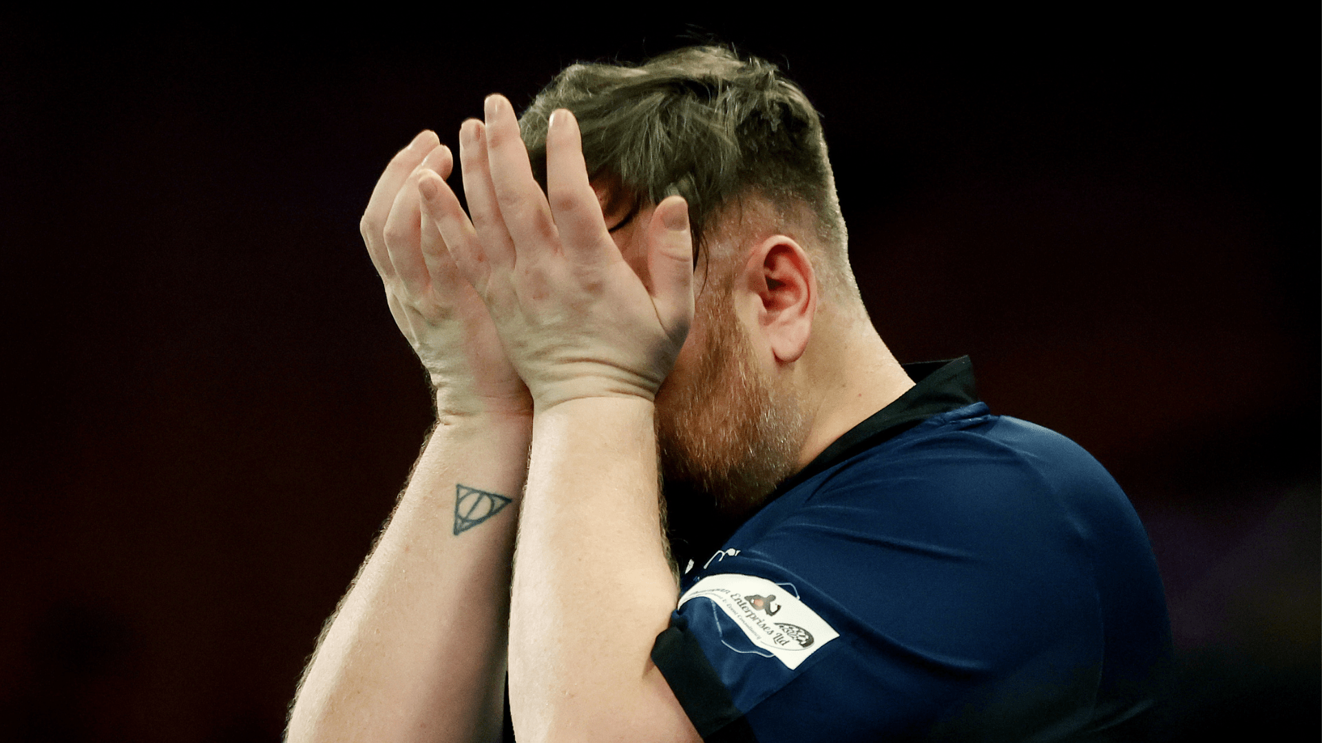 Fans slam 'disgraceful' treatment of Rangers-daft darts star during defeat as he breaks down in tears before match ends