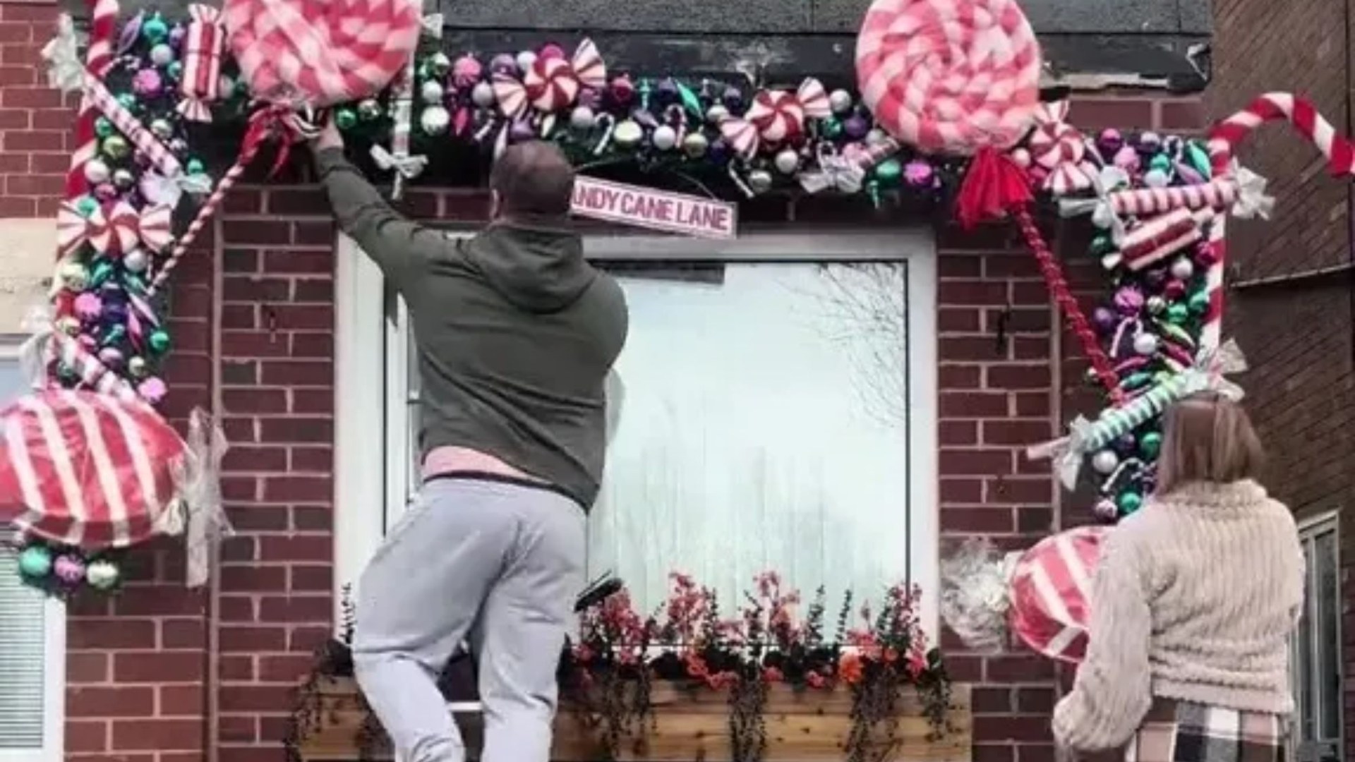 I DIY'd a candy-themed Christmas garland that covers my house - it's not over the top, I think it looks spectacular