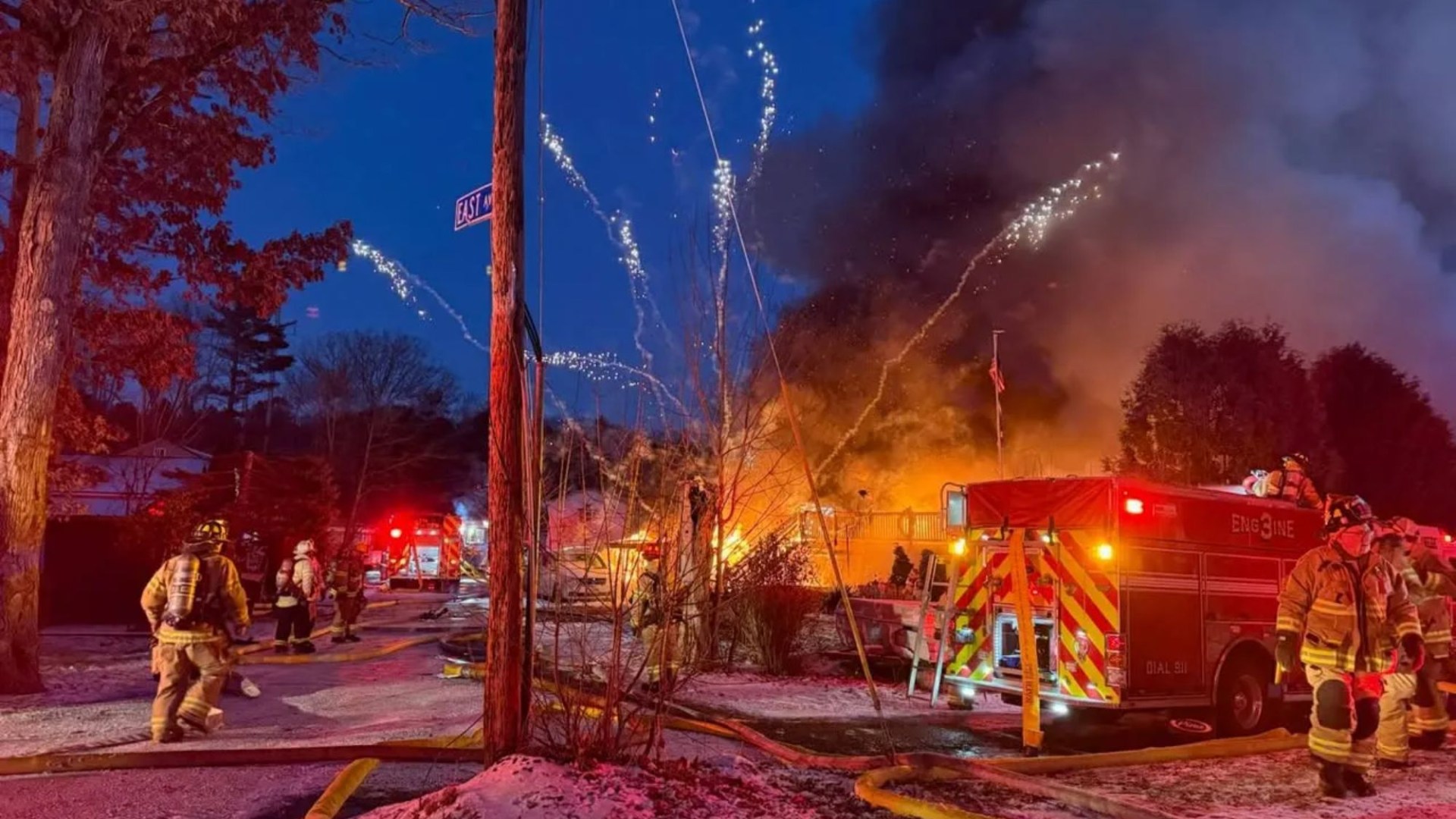 Watch terrifying moment barrage of fireworks launch from huge house blaze as firefighters battle inferno