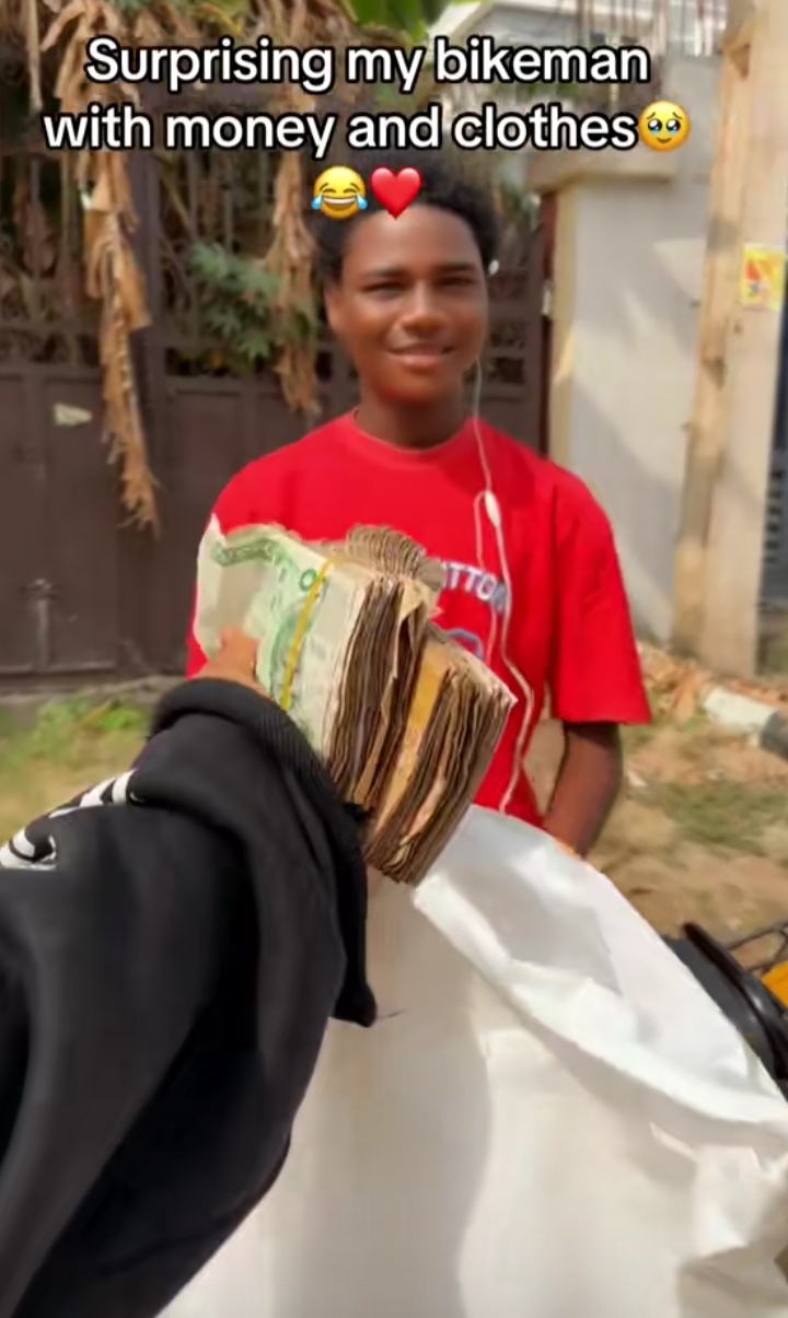 Emotional moment lady surprises her bikeman with cash and clothes