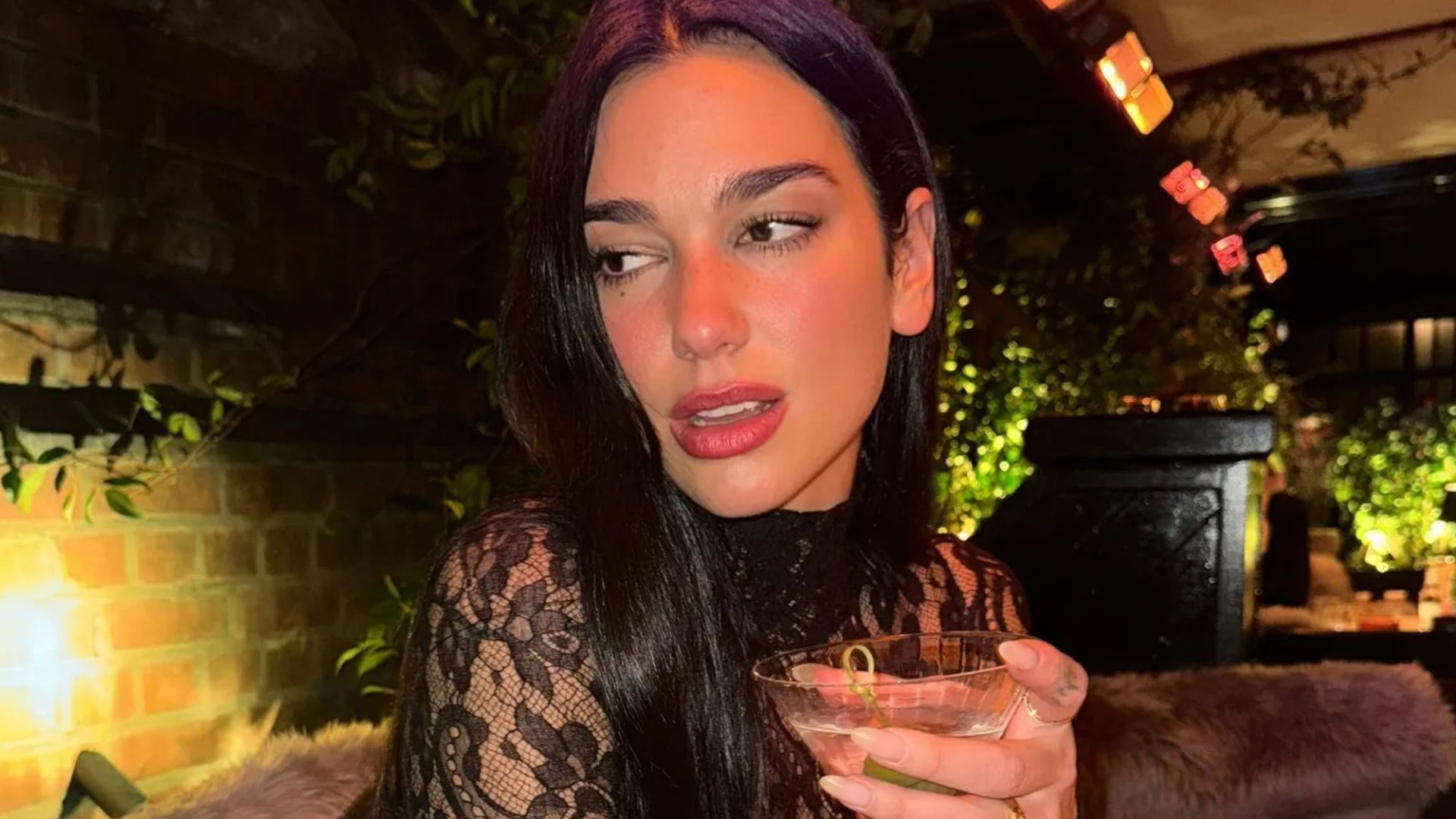 Dua Lipa shows off huge engagement ring and looks incredible in see-through lace outfit after Callum Turner's proposal