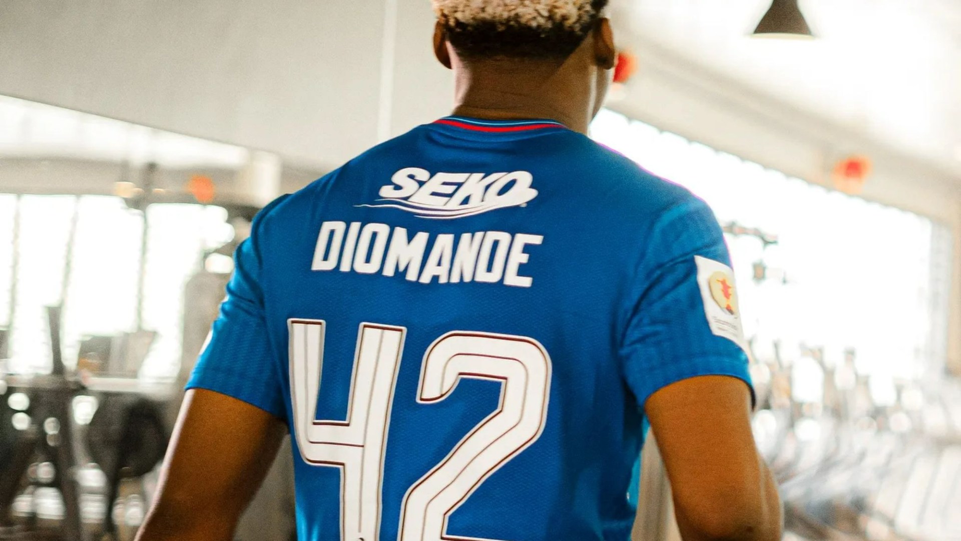 Highly-rated young African defender spotted wearing Rangers strip in gym as he works out at Champions League club